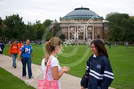Female students socialize on the campus of the University of Illinois at Champaign.