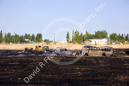 Burned vehicles in the aftermath of a wildfire near Mountain Home, Idaho.
