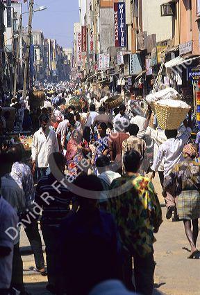 Crowded market street scene in Bangalore, India.