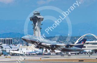 Boeing 747 airplane taking off from LAX airport in Los Angeles, California.