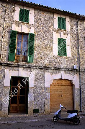 Residence with scooter parked outside in Majorca, Spain.