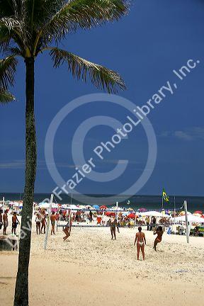 People playing beach volleyball at Ipanema Beach in Rio de Janerio, Brazil.