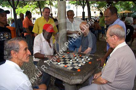 Elderly men playing checkers at a park in Rio de Janeiro, Brazil.