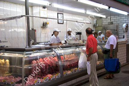 People shopping for meat at the Mercado Municipal in Sao Paulo, Brazil.