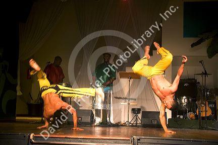 Men perform a martial arts dance called Capoeira at a nightclub in Sao Paulo, Brazil.