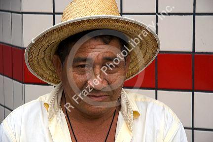Elderly Brazilian man wearing a straw hat in Manaus, Brazil.