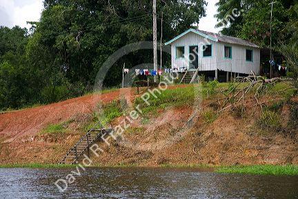 House on stilts along the Arasa River in the Amazon jungle near Manaus, Brazil.
