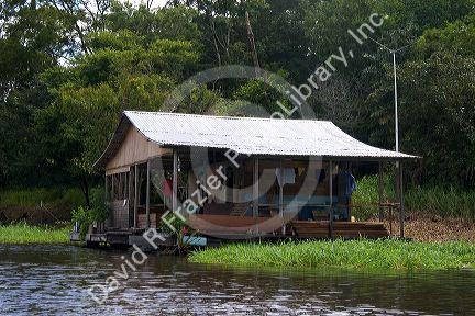 A house along the Arasa River in the Amazon jungle near Manaus, Brazil.