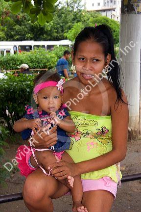 Brazilian woman holding her baby in Manaus, Brazil.