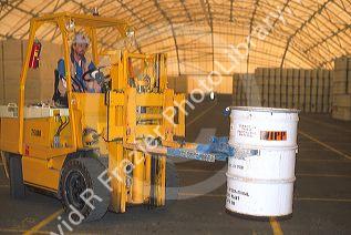 A forklift operator moves a drum of radioactive nuclear waste inside the Idaho National Engineering Lab. Idaho Falls, Idaho.
