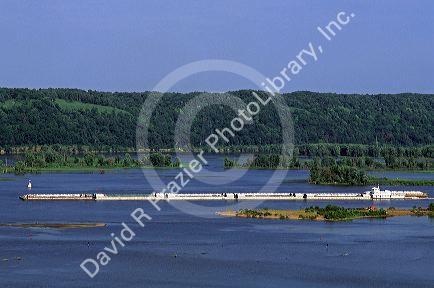 Tugboat and barge tow on the Mississippi River in Iowa.