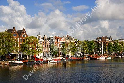 Row houses along the Amstel River in Amsterdam, Netherlands.