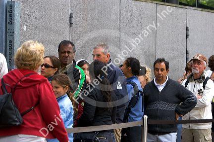 Diverse crowd waiting in line to enter the Anne Frank House in Amsterdam, Netherlands.