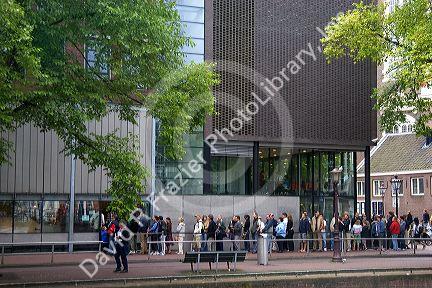 People stand in line to enter the Anne Frank House in Amsterdam, Netherlands.