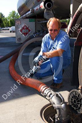 A man delivering gasoline to a gas station in Boise, Idaho.
