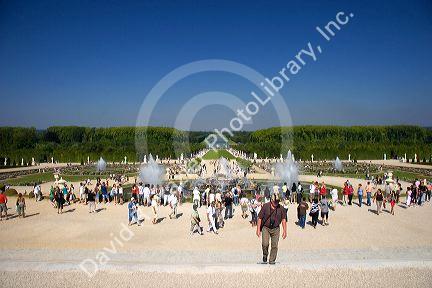 Tourists visit the formal gardens at The Palace of Versailles at Versailles in the department of Yvelines, France.