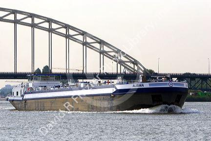 A barge on the Nieuwe Maas river at Rotterdam, Netherlands.