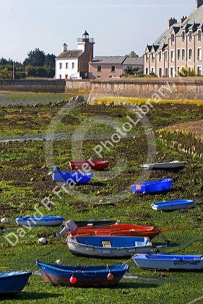 Low tide in the harbor at the village of Barfleur in the region of Basse-Normandie, France.
