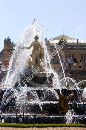 A water fountain in the formal gardens at The Palace of Versailles at Versailles in the department of Yvelines, France.