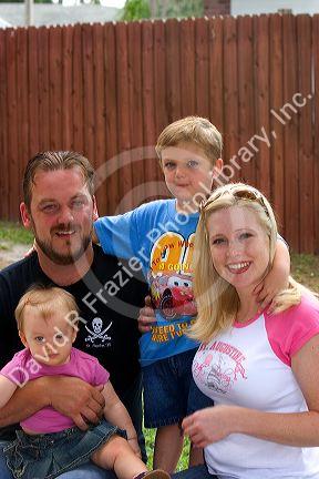 Family portrait with mother, father, son, and daughter in Florida. MR