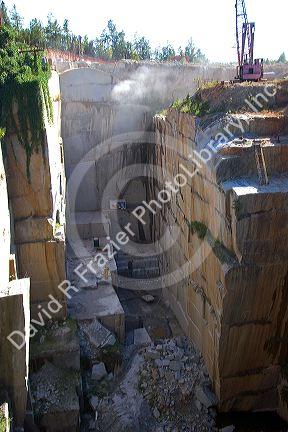 Workers drilling and cutting blocks at a granite quarry in Elberton, Georgia.