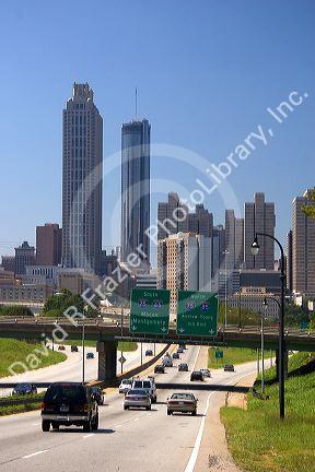 Automobiles travel on the interstate entering downtown Atlanta, Georgia.