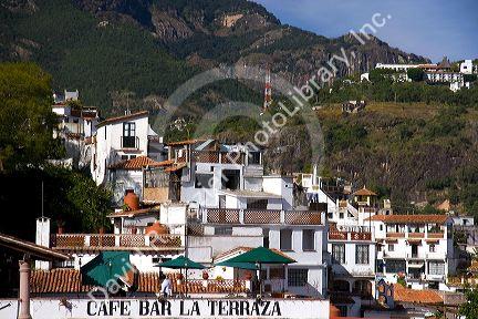 Rooftop cafe and tile roofed homes at Taxco in the State of Guerrero, Mexico.