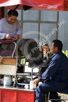 A shoeshiner at Insurgentes Plaza in Mexico City, Mexico.