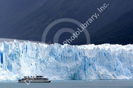 Tour boat in front of the Perito Moreno Glacier located in the Los Glaciares National Park in the south west of Santa Cruz province, Patagonia, Argentina.