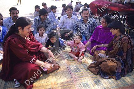 Indian families at the beach in Mumbai Bombay, India.