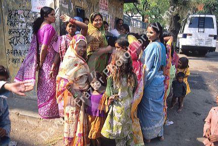 Women lined up for milk in Delhi, India.
