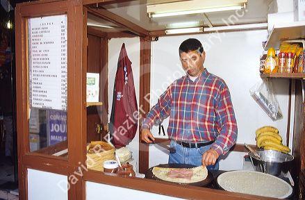 French man making crepes.