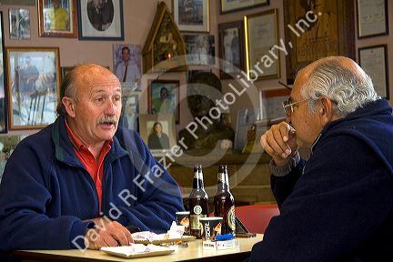 Argentine men socialize in the Panaderia Union bakery at Tolhuin, Tierra del Fuego, Argentina.