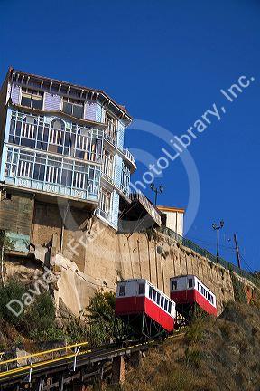 Tram-like vehicles are part of a funicular railway at Valparaiso, Chile.