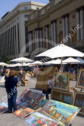 Vendor selling art in the Plaza de Armas in Santiago, Chile.