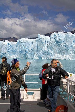 Passengers on a tour boat at the Perito Moreno Glacier located in the Los Glaciares National Park in the south west of Santa Cruz province, Patagonia, Argentina.