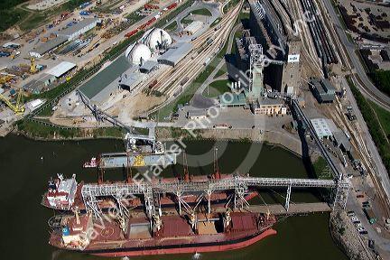 Ships docked near grain elevators along the Houston Ship Channel in Houston, Texas.