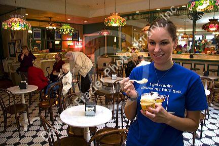 Employee with ice cream at the Blue Bell Creamery in Brenham, Texas.