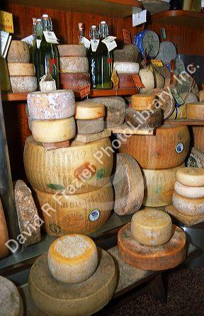 Cheese display at a shop in Lucca, Tuscany, Italy.