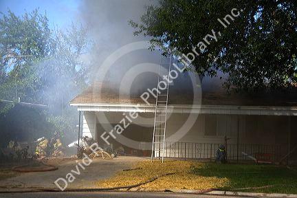 Firefighters respond to a house fire in Boise, Idaho.