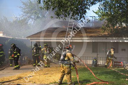 Firefighters respond to a house fire in Boise, Idaho.
