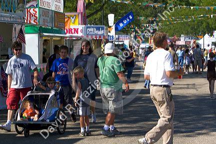 People walk amongst food stands at the Western Idaho Fair in Boise, Idaho.