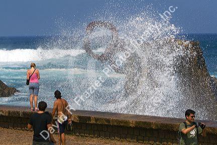 Water spraying from a blowhole in La Concha Bay in the city of Donostia-San Sebastian, Guipuzcoa, Basque Country, Northern Spain.