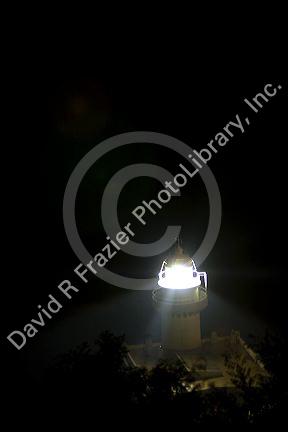 Monte Igueldo Lighthouse at night in La Concha Bay near the city of Donostia-San Sebastian, Guipuzcoa, Basque Country, Northern Spain.