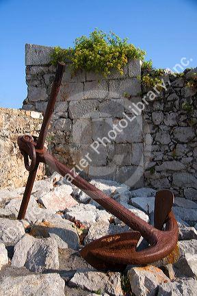 Large boat anchor in the harbor at Llanes, Asturias, Spain.