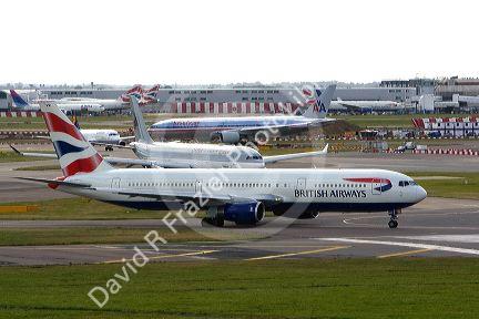 Airliners on the runway at London Heathrow Airport, England, United Kingdom.