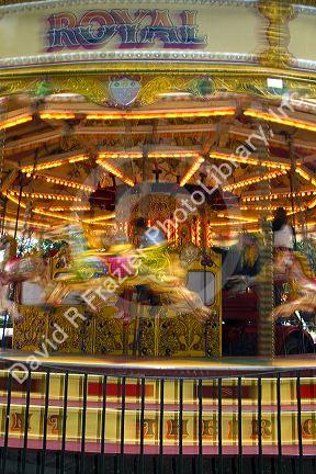 Merry-go-round in motion in the market town of Stratford-upon-Avon, Warwickshire, England.