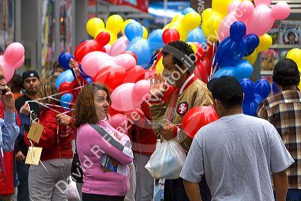 Promotional Disney balloons being handed out in Times Square, Manhattan, New York City, New York, USA.