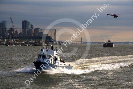 New York City Police Department Harbor Unit, helicopter on the Hudson River in New York Harbor, New York, USA.
