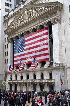 American flags in front of the New York Stock Exchange in New York City, New York, USA.